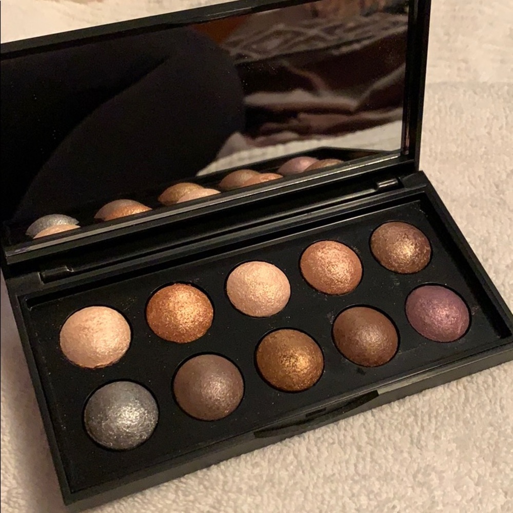 Eye shadow palette and makeup bag.